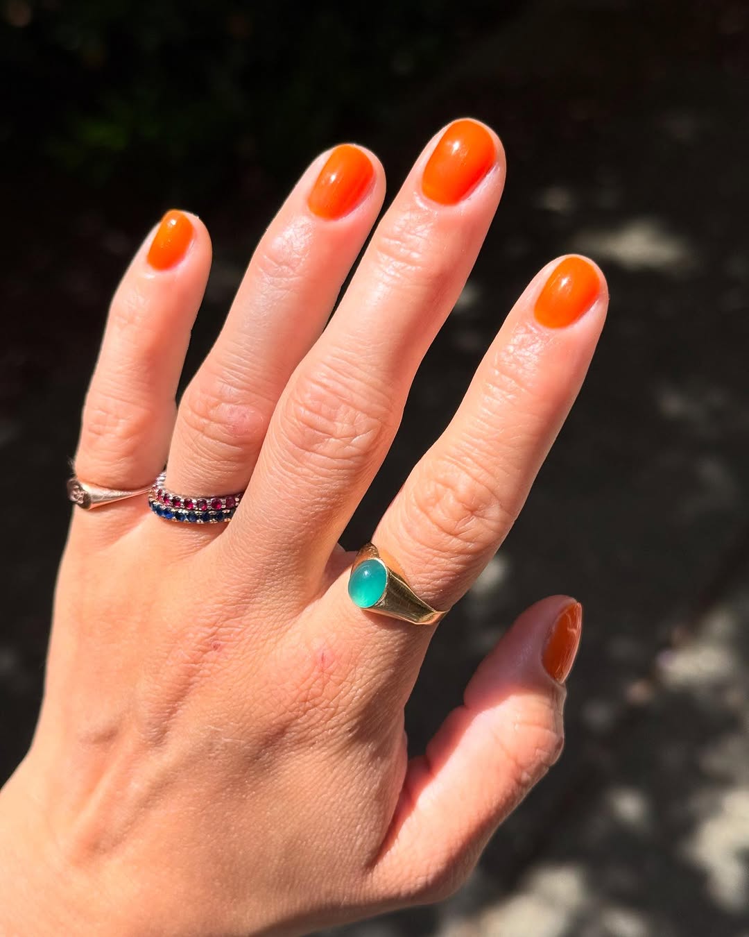 Vibrant orange nails for a sunny vibe