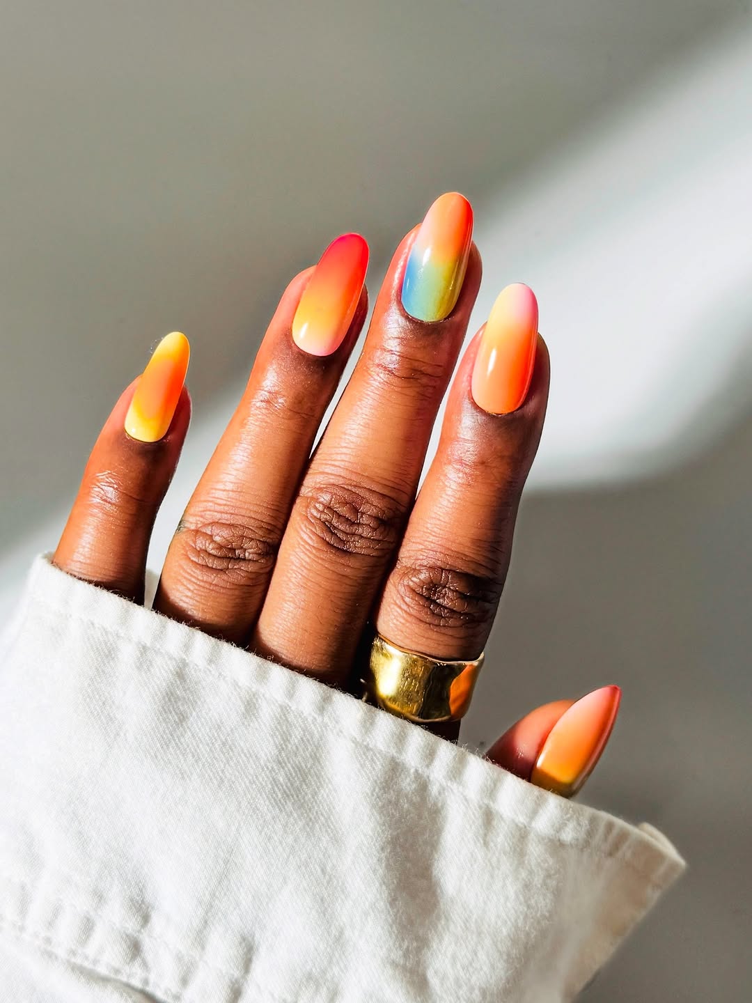 Vibrant orange nails with a stunning gradient