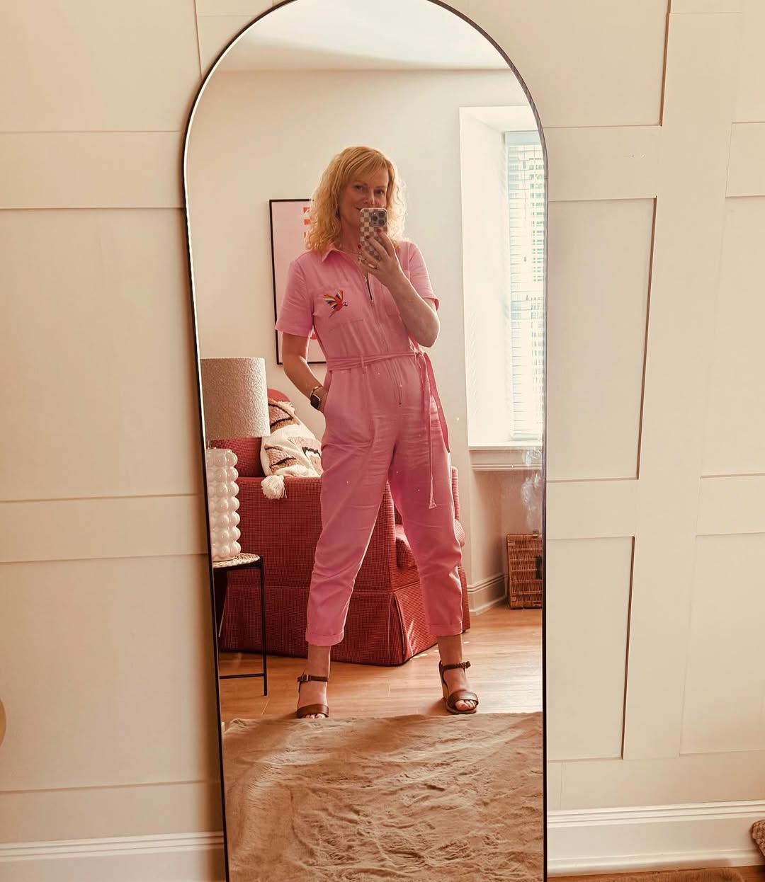 Chic and playful pink jumpsuit outfit