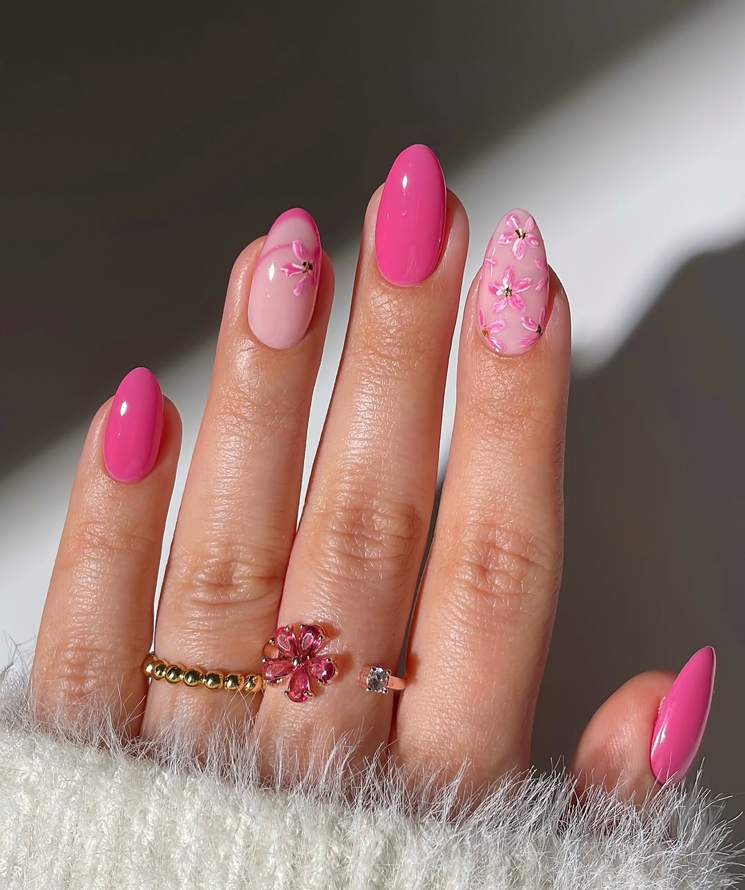 Chic pink nails with floral accents