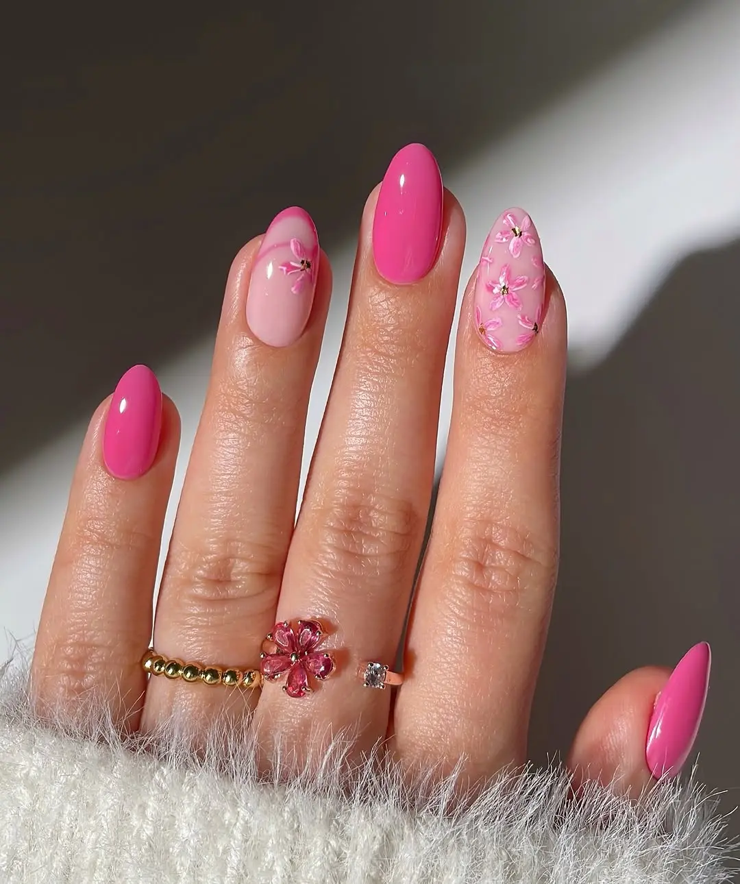 Chic pink nails with floral accents