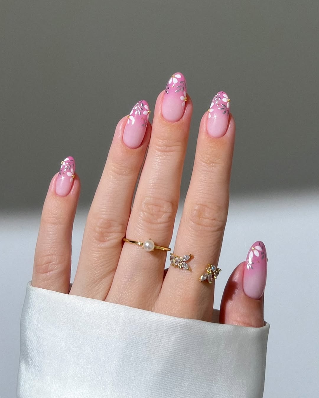 Elegant pink nails with floral accents