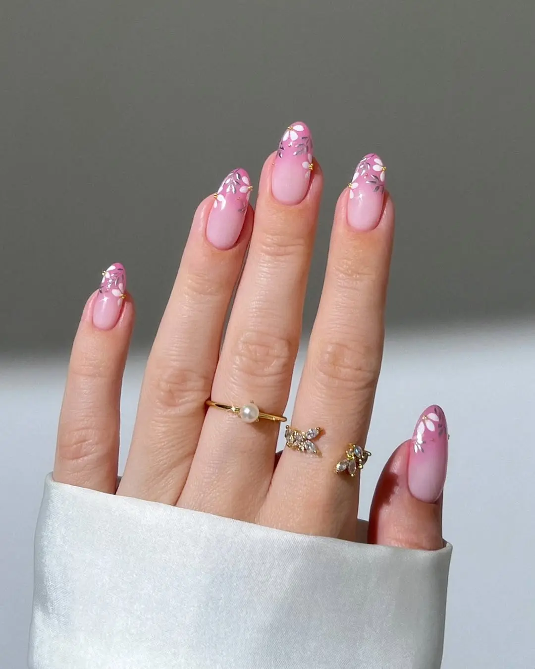 Elegant pink nails with floral accents