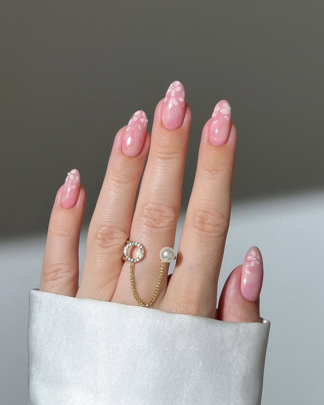 Chic pink nails with floral accents