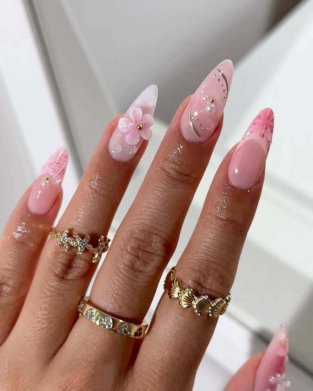Chic pink nails with floral accents