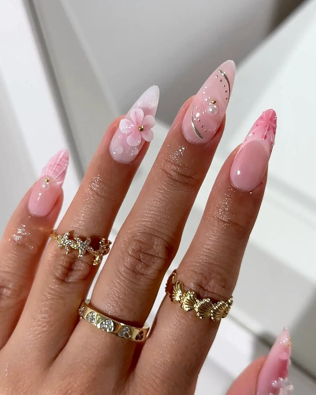 Chic pink nails with floral accents