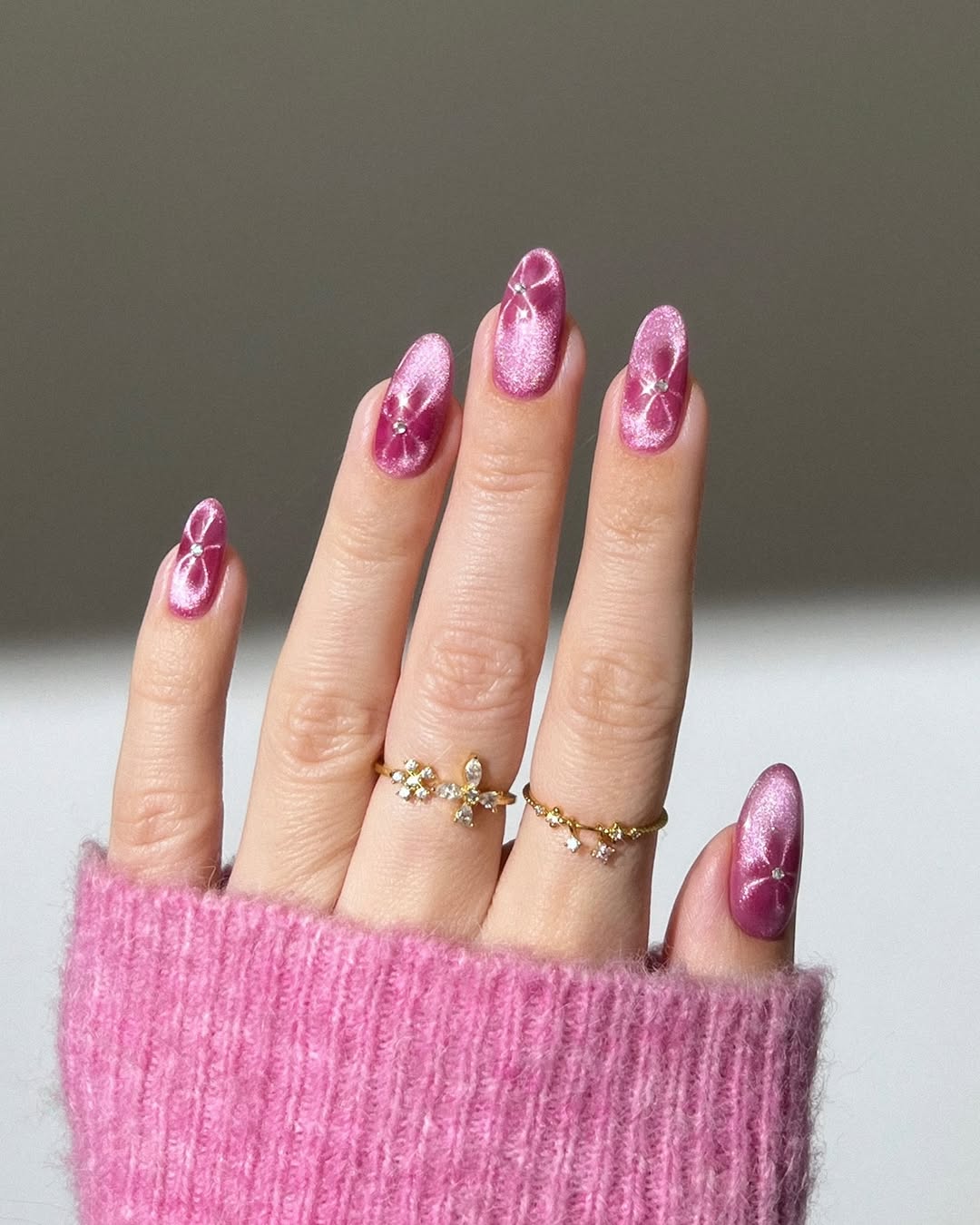 Sparkling pink nails with unique designs