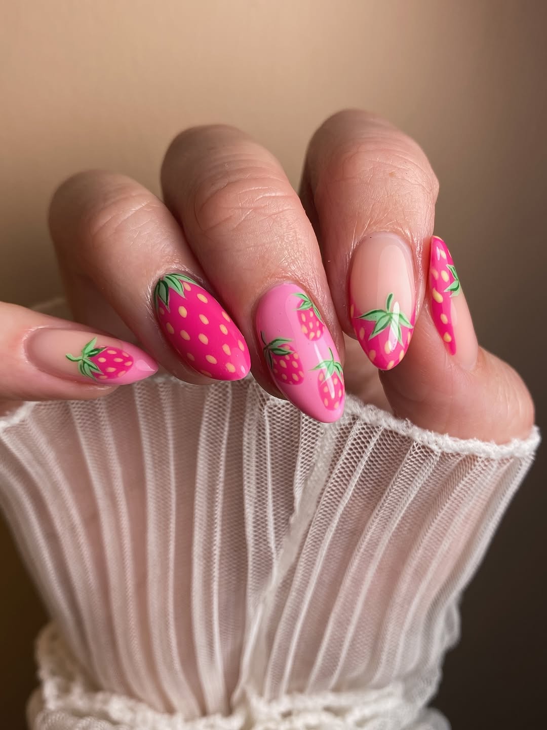 Playful pink nails with fruity designs