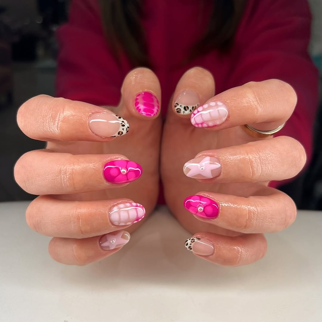 Creative pink nail art with playful designs