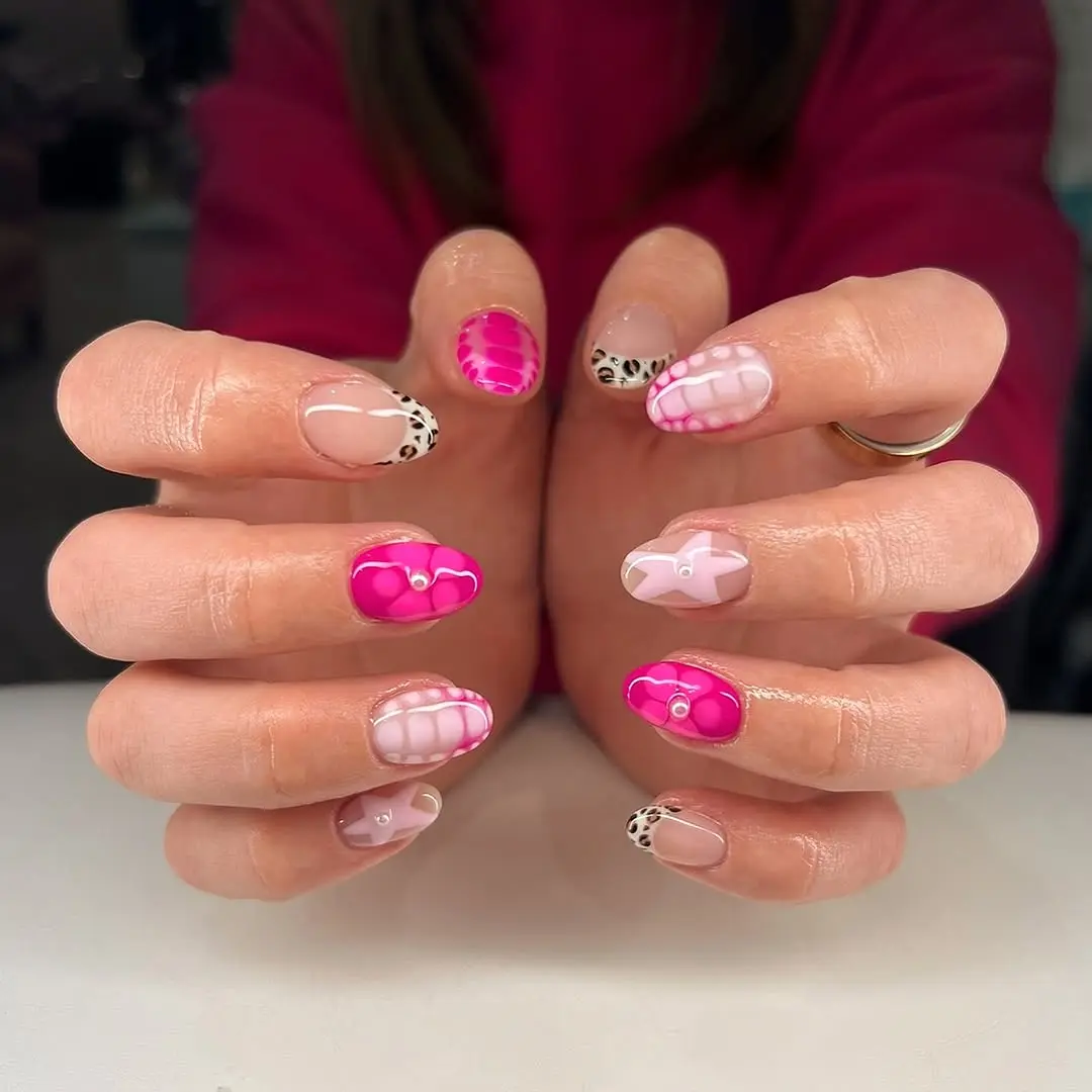 Creative pink nail art with playful designs