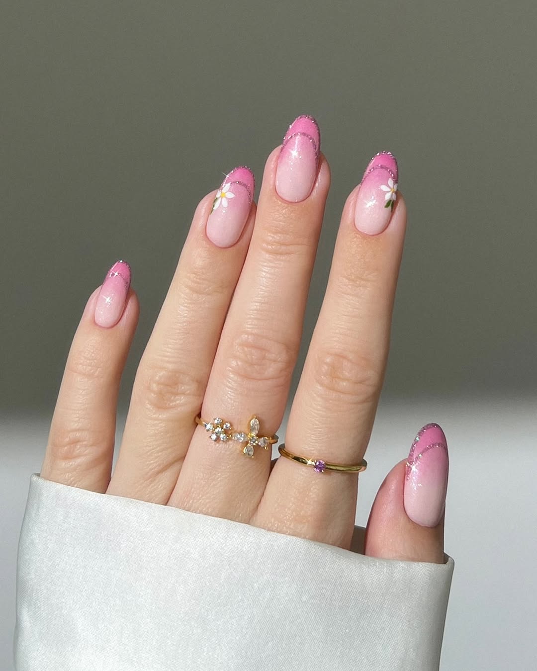 Stylish pink nails with floral accents