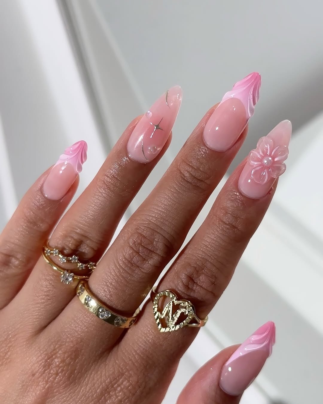 Elegant pink nails with charming floral accents