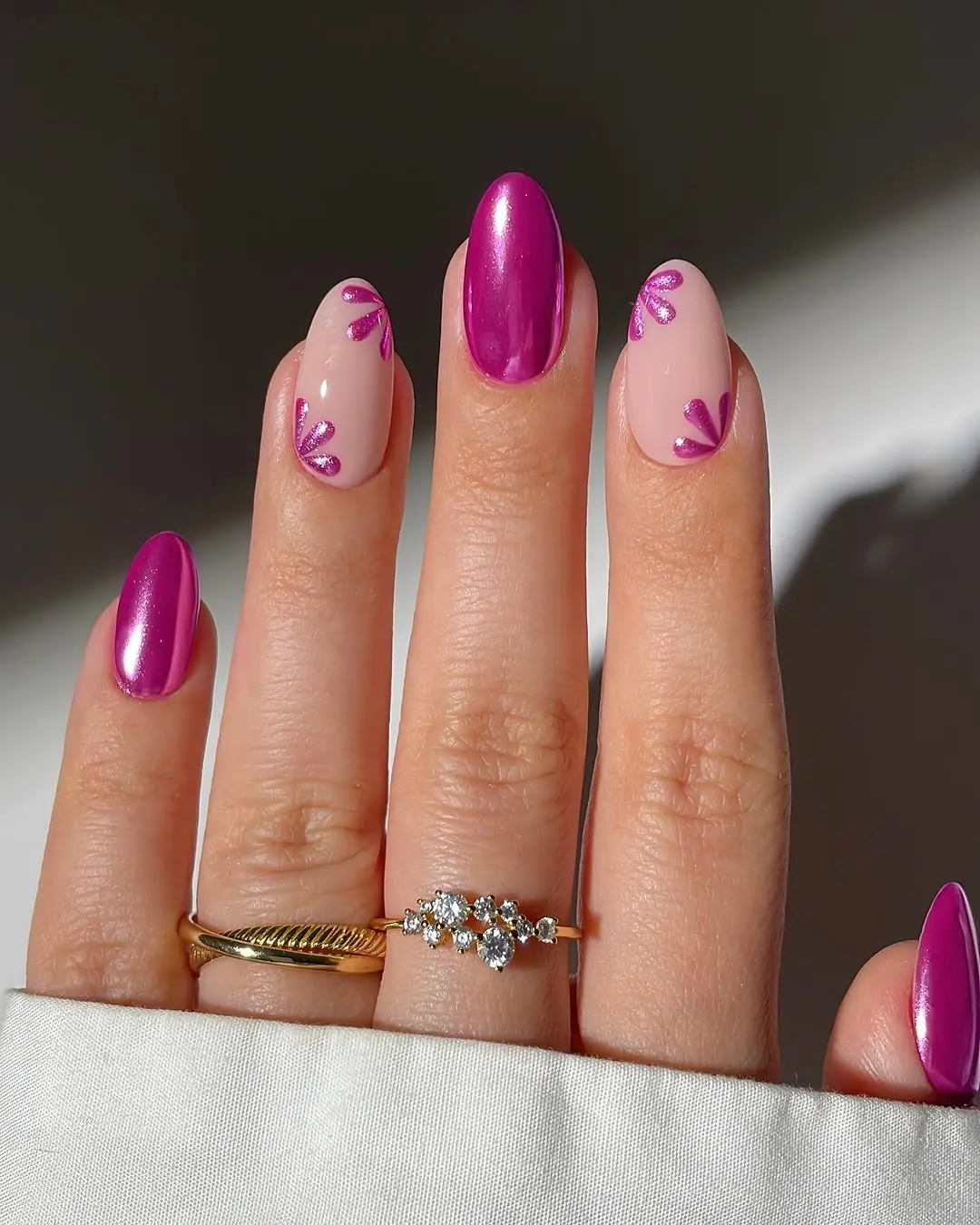 Vibrant Pink Nails with Floral Accents