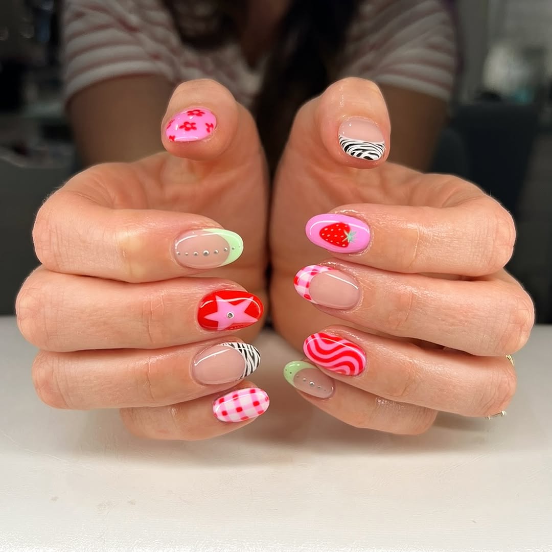 Vibrant pink nails with playful patterns