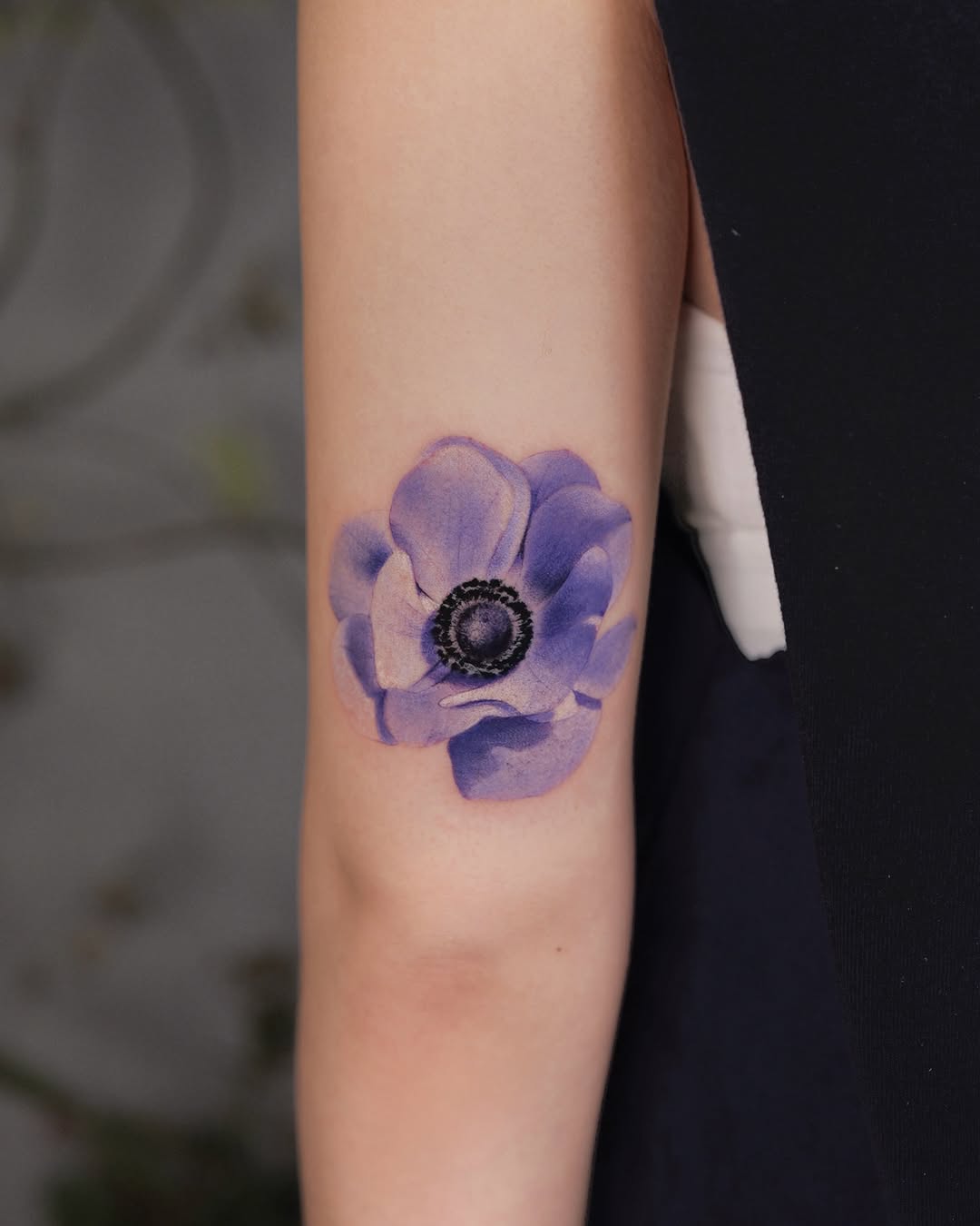 Elegant purple anemone flower tattoo design