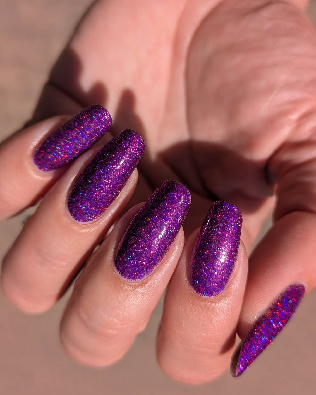Glamorous purple glitter nails steal the spotlight