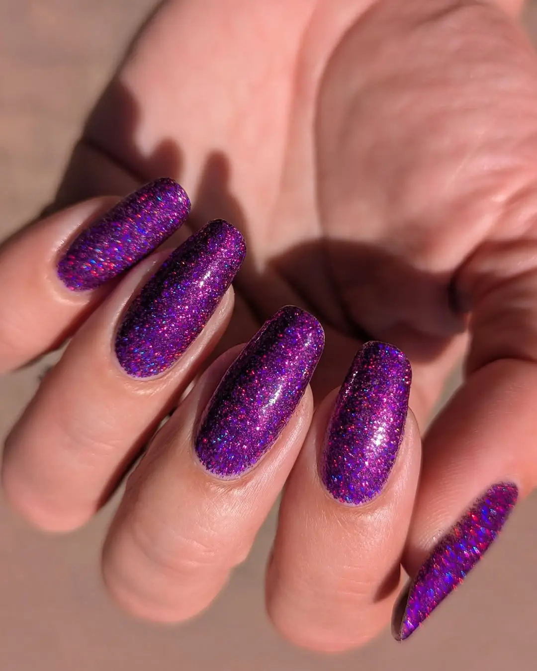 Glamorous purple glitter nails steal the spotlight