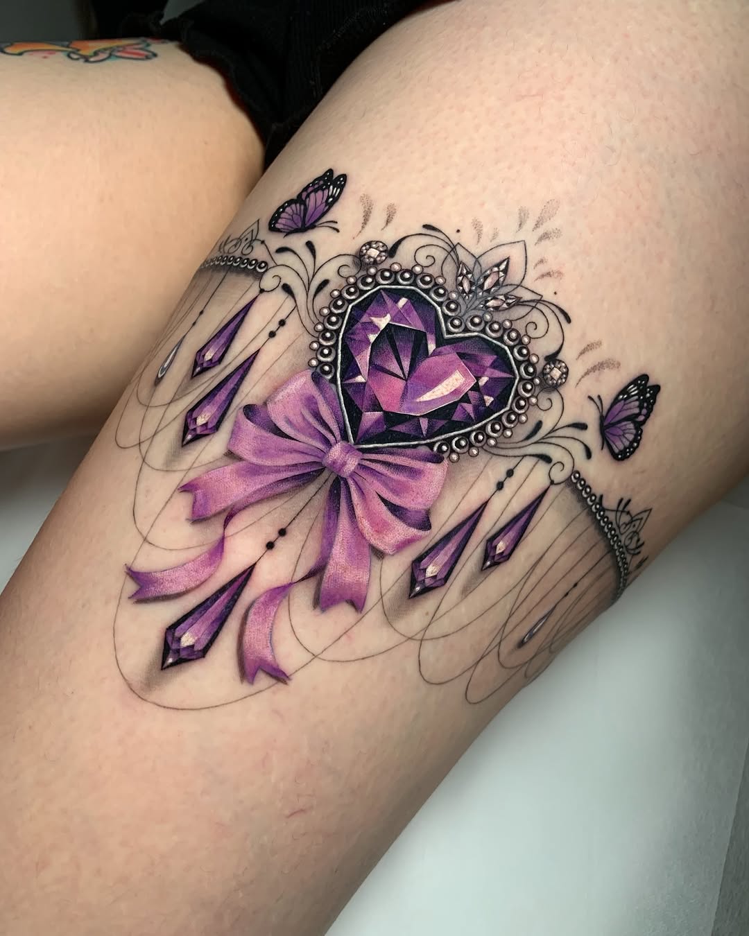 Elegant heart tattoo with bow and butterflies