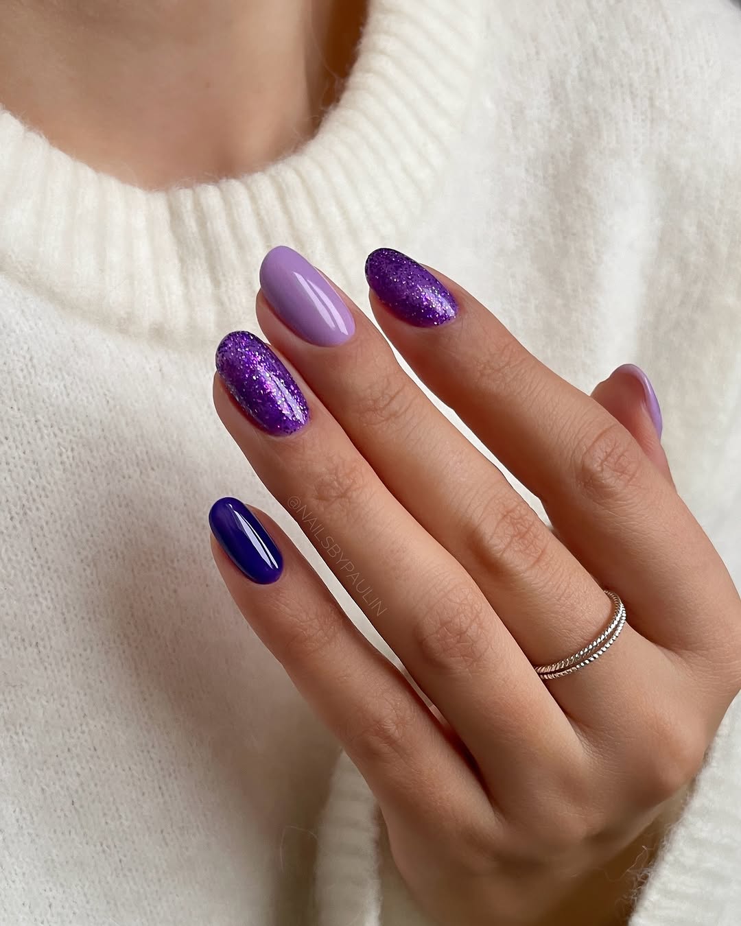 Chic purple nails with dazzling glitter accents