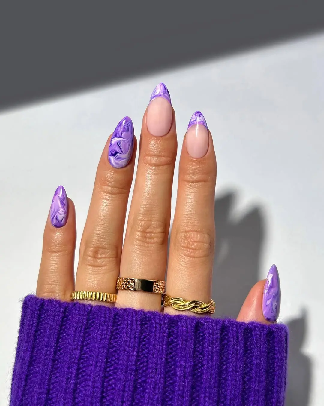 Chic marbled purple nail design for a bold look