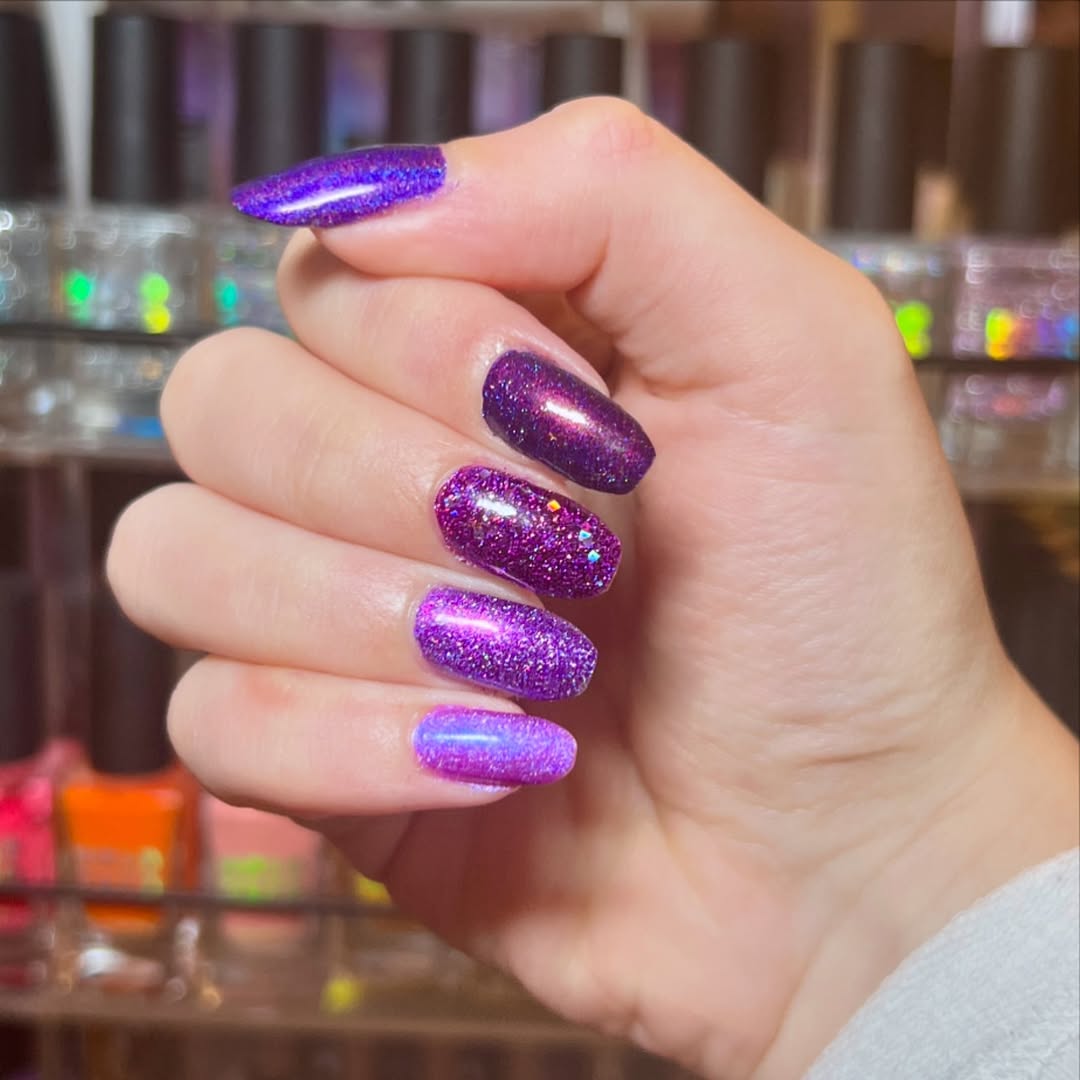 Glossy purple nails with stunning glitter effects