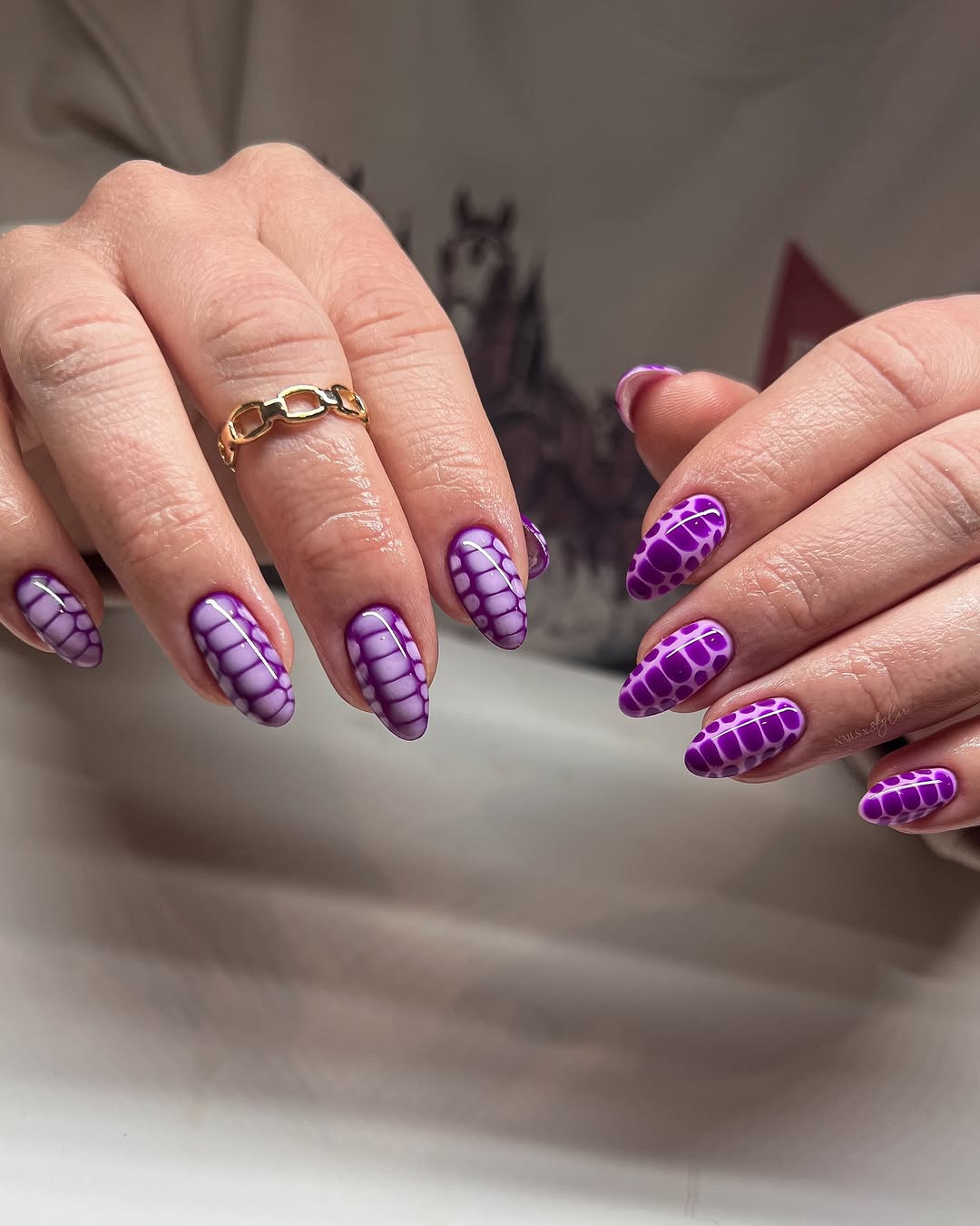 Trendy Purple Nail Design with Unique Patterns