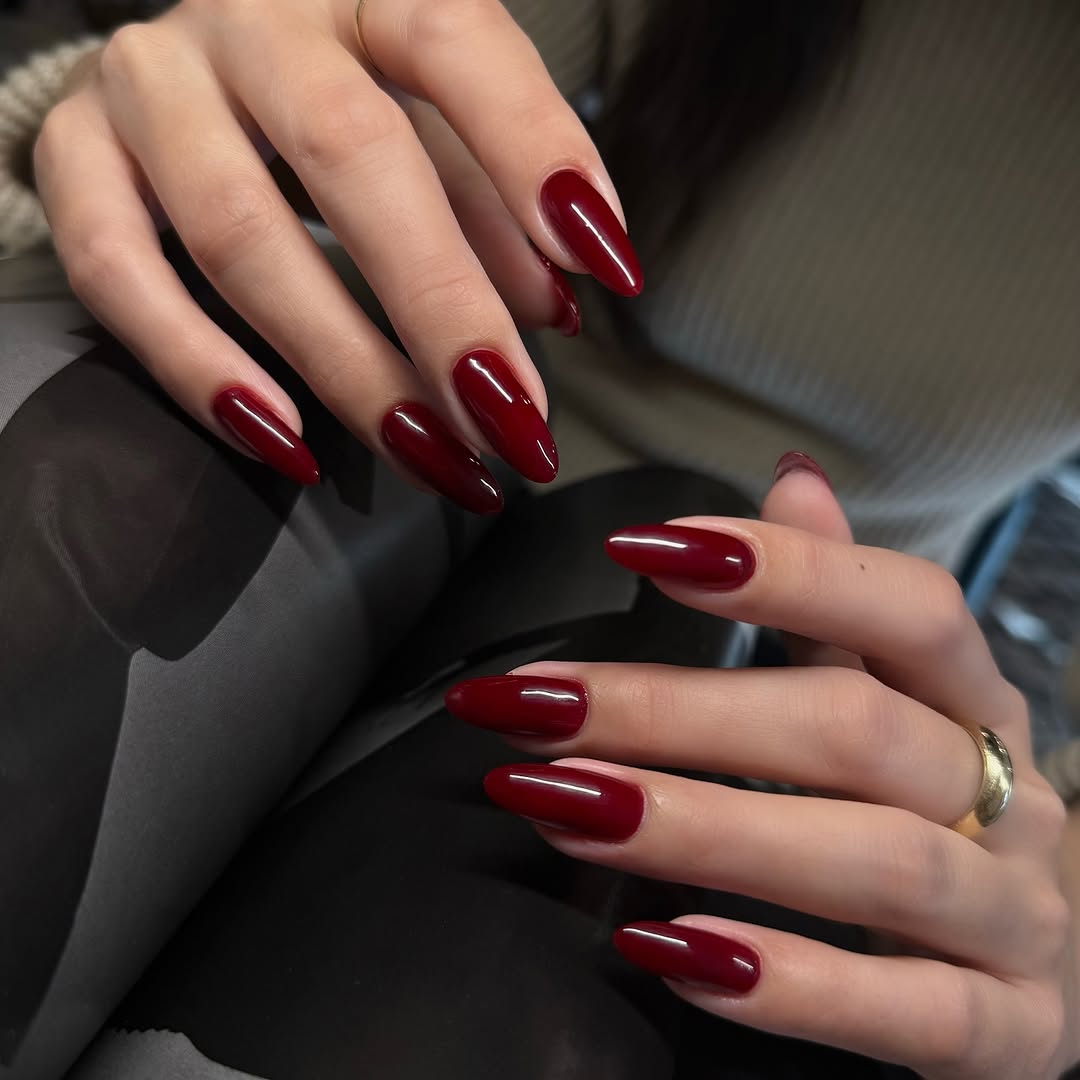 Sophisticated red almond-shaped nail design