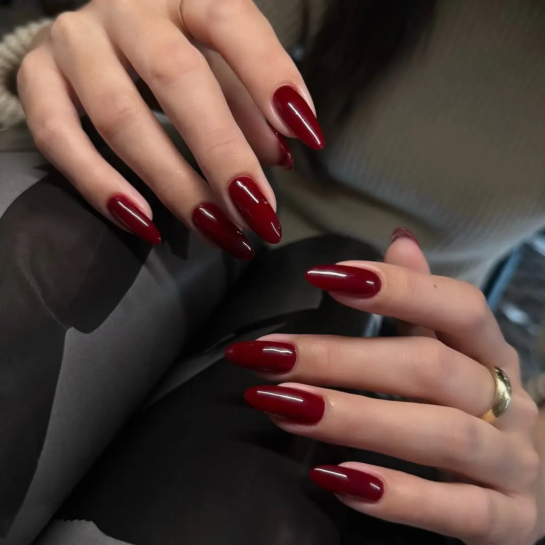 Sophisticated red almond-shaped nail design
