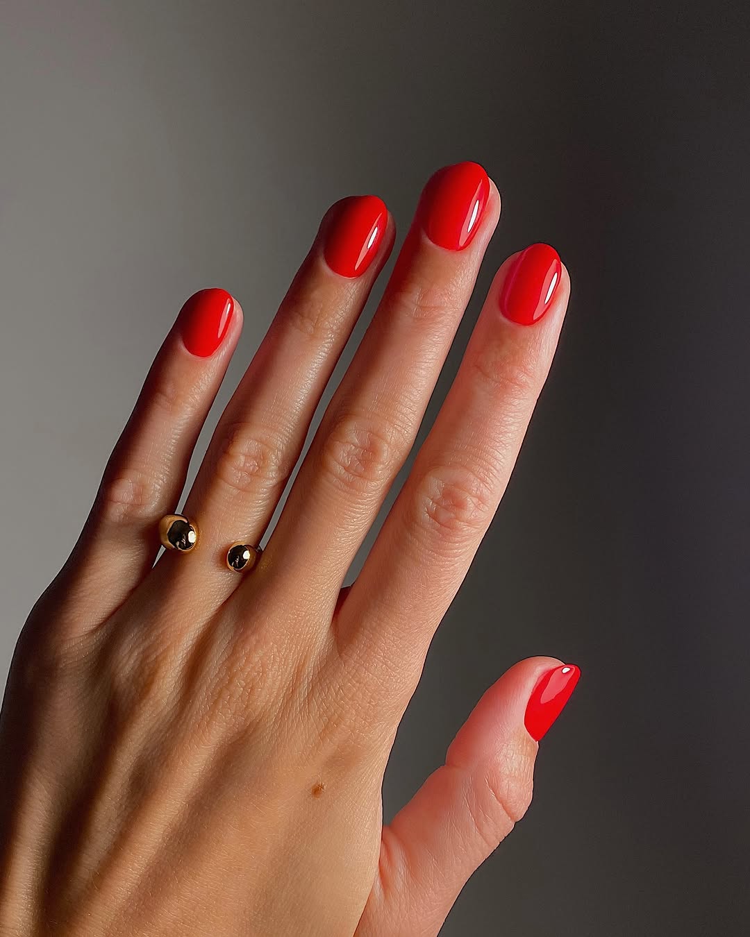 Vibrant red nails with a glossy finish
