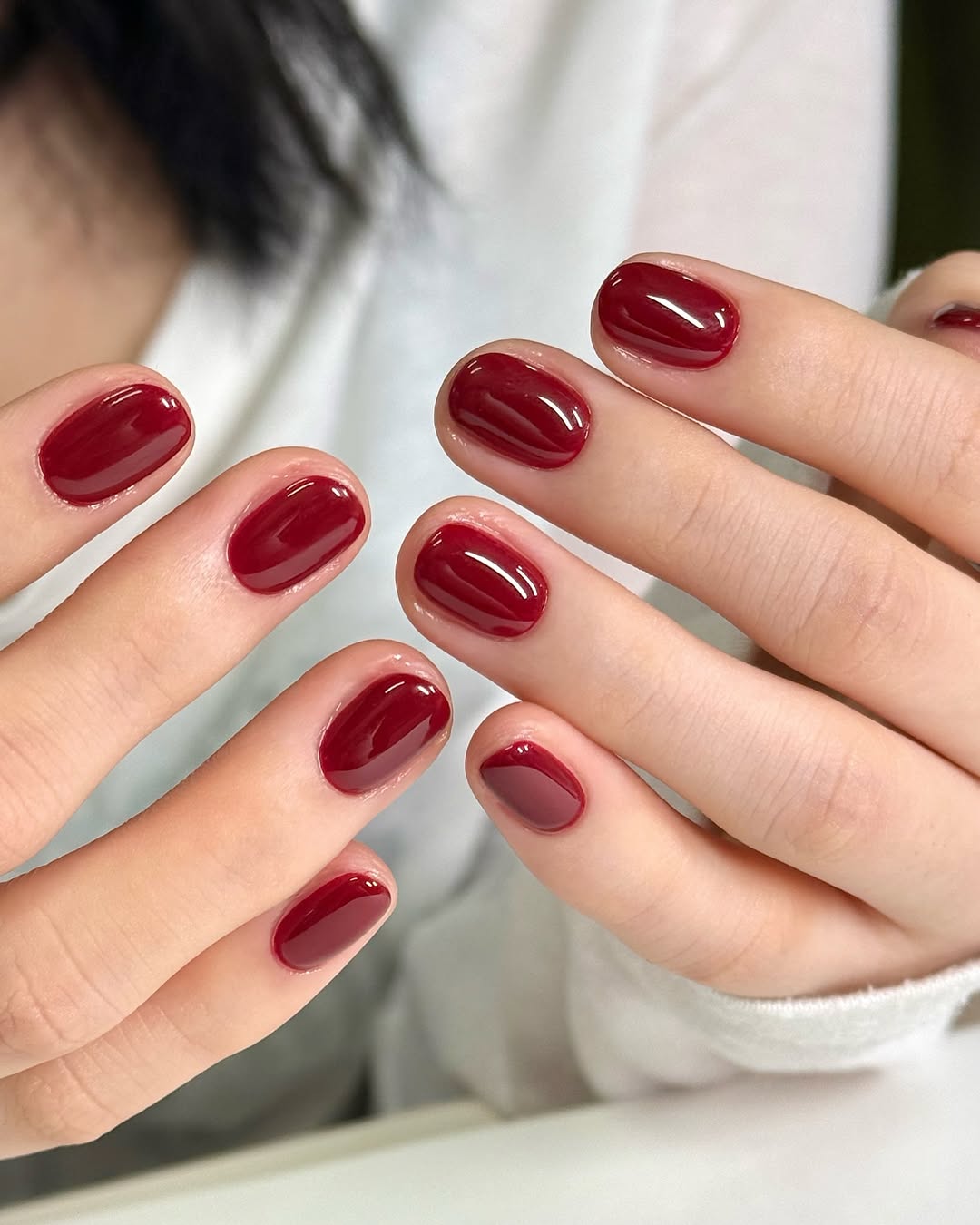 Sleek glossy red nails for a chic look