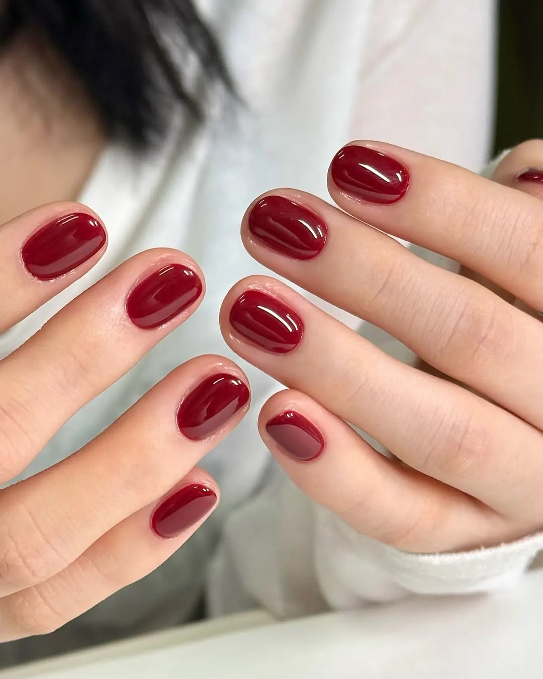 Sleek glossy red nails for a chic look