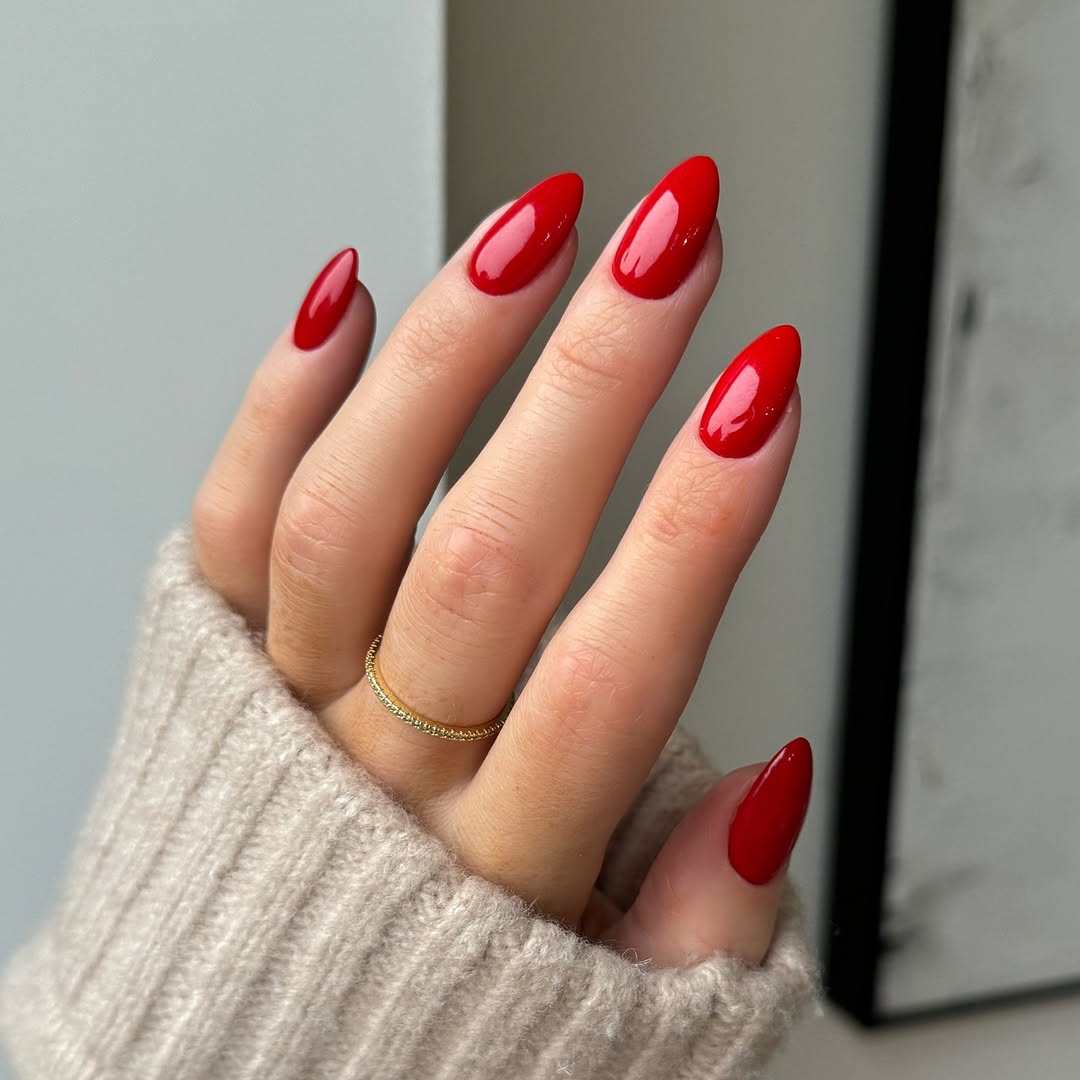 Vibrant red nails with a sleek finish