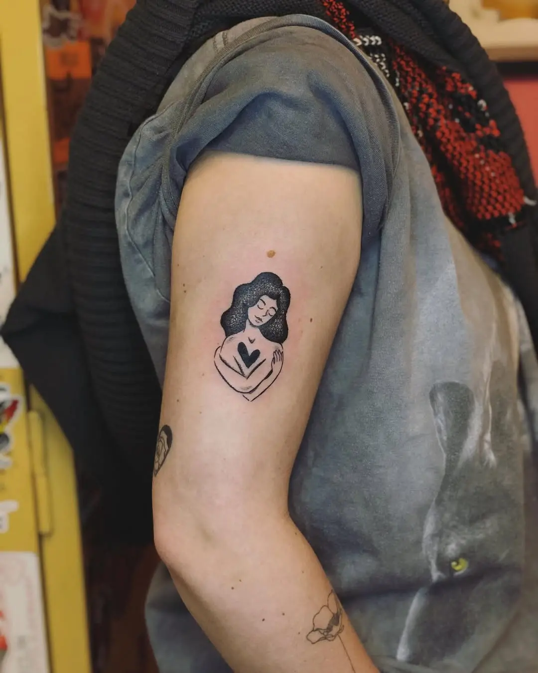 Empowering self-love tattoo on the inner arm