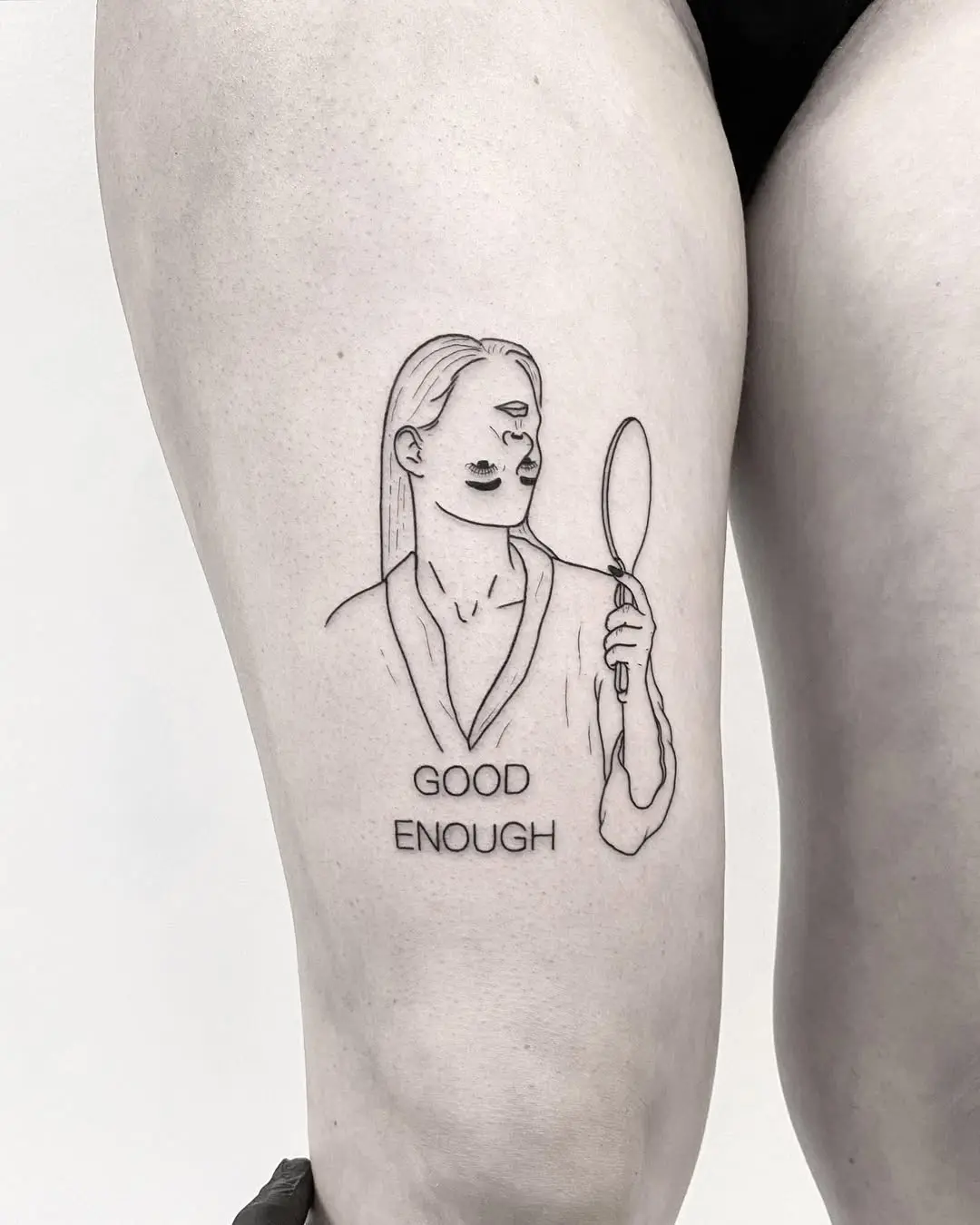 Empowering self-love tattoo with mirror reflection