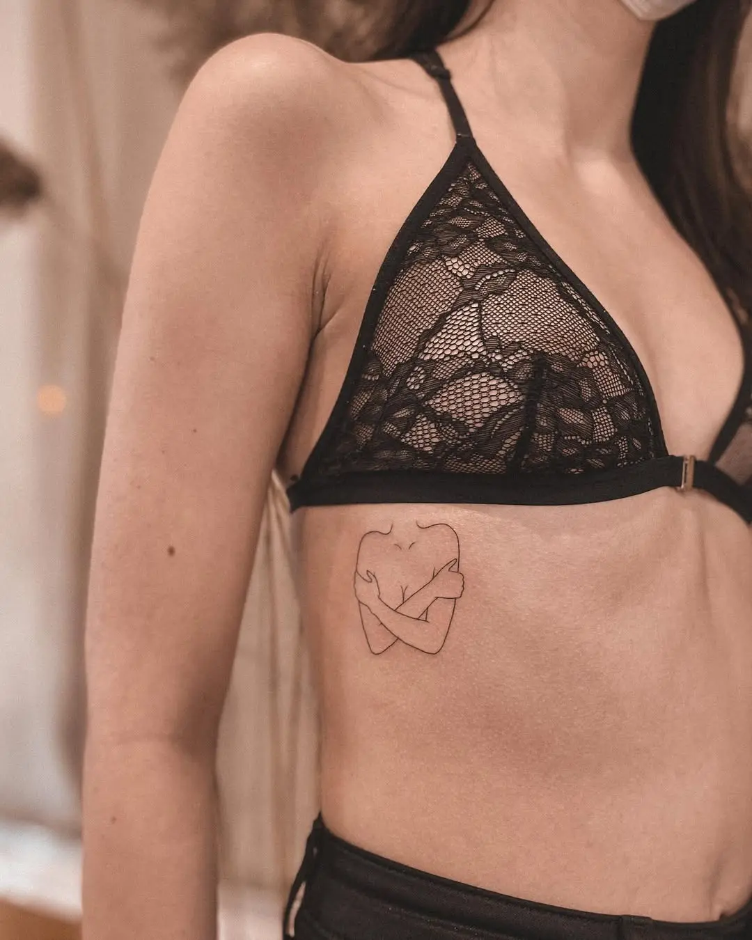 Elegant minimalistic self-love tattoo on skin