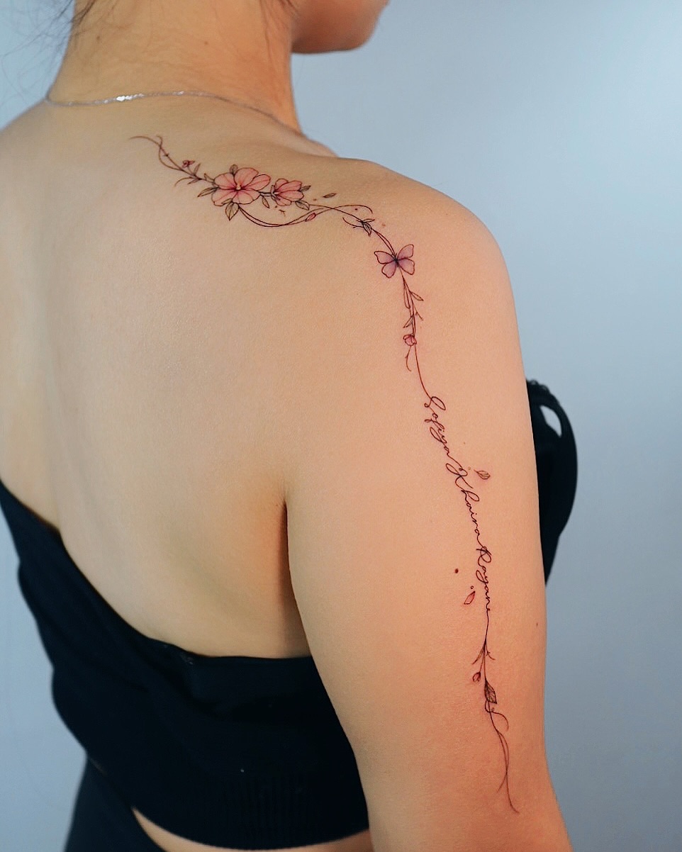 Delicate floral shoulder tattoo design for women