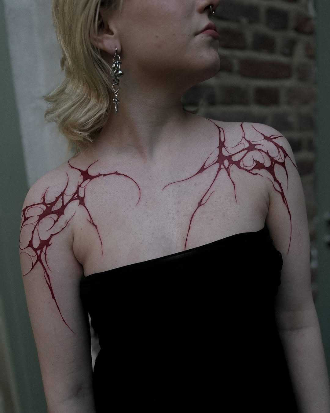 Striking Abstract Red Shoulder Tattoo Design