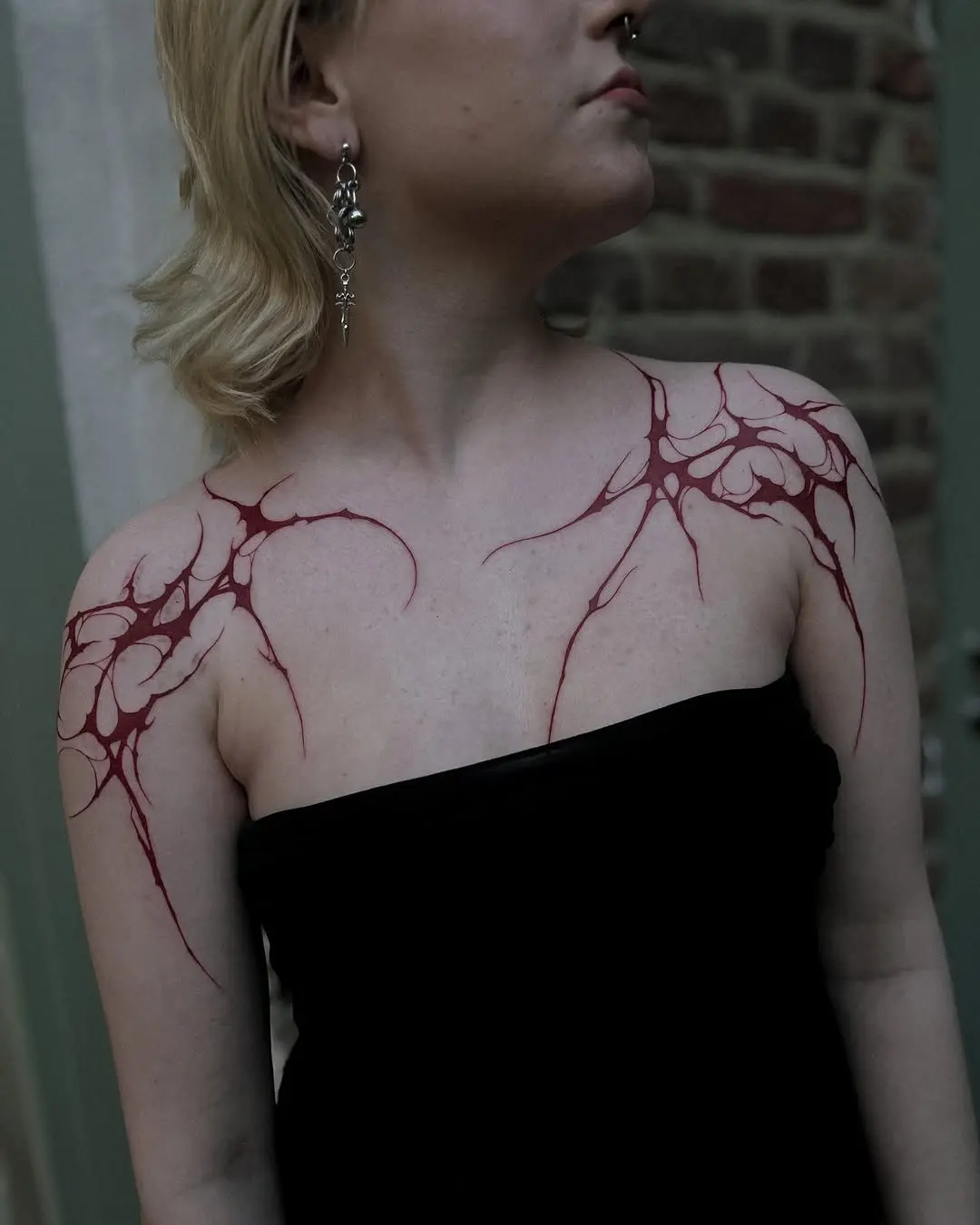 Striking Abstract Red Shoulder Tattoo Design