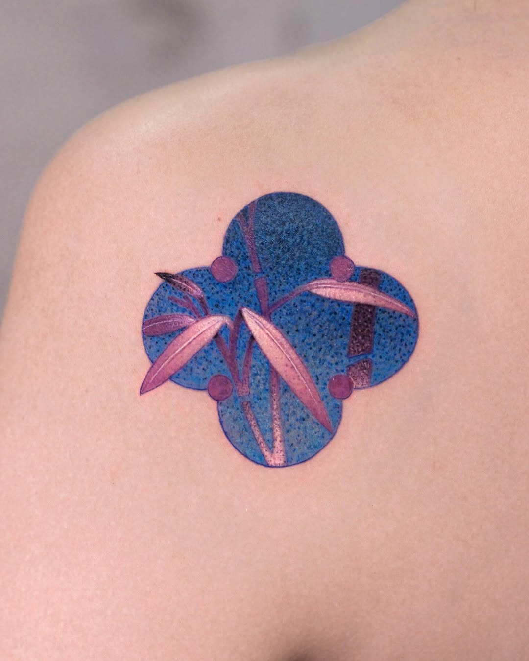 Vibrant bamboo design on shoulder elegance