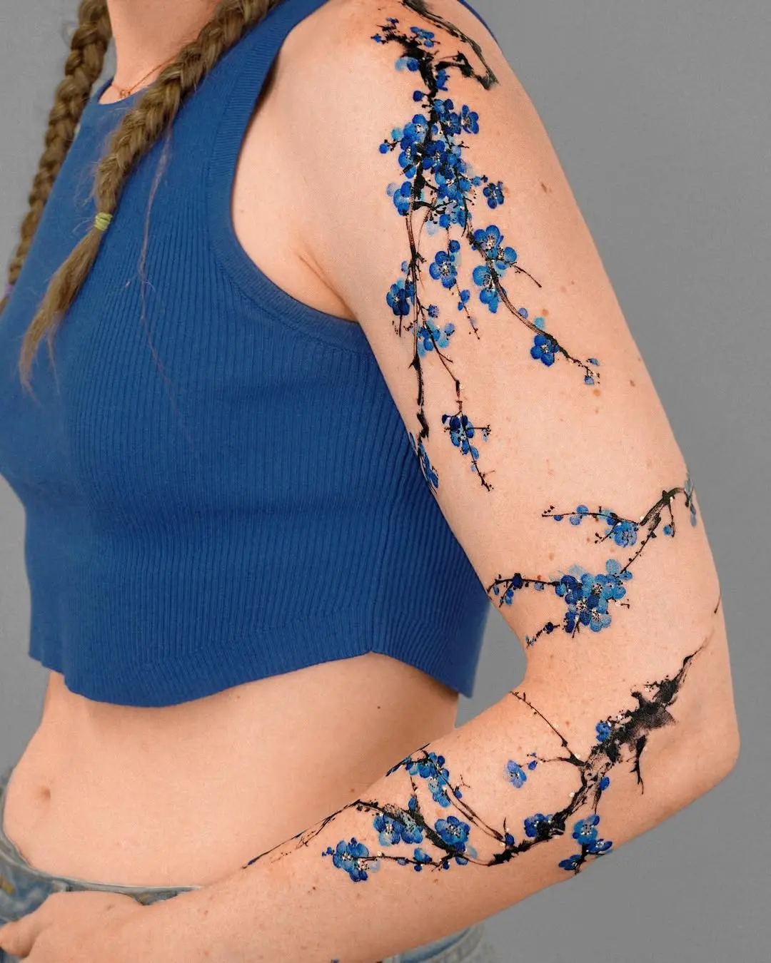 Elegant blue floral shoulder tattoo design