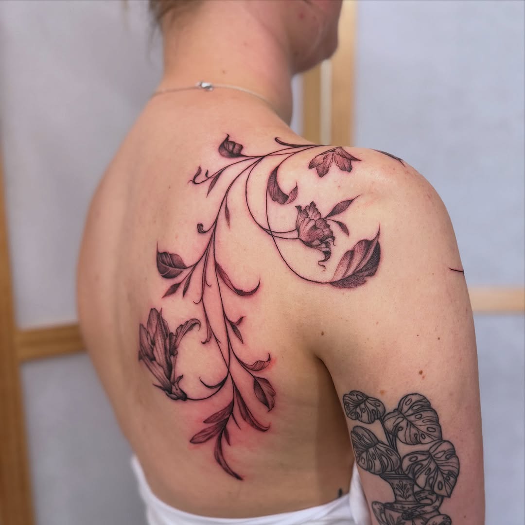 Elegant floral shoulder tattoo design concept
