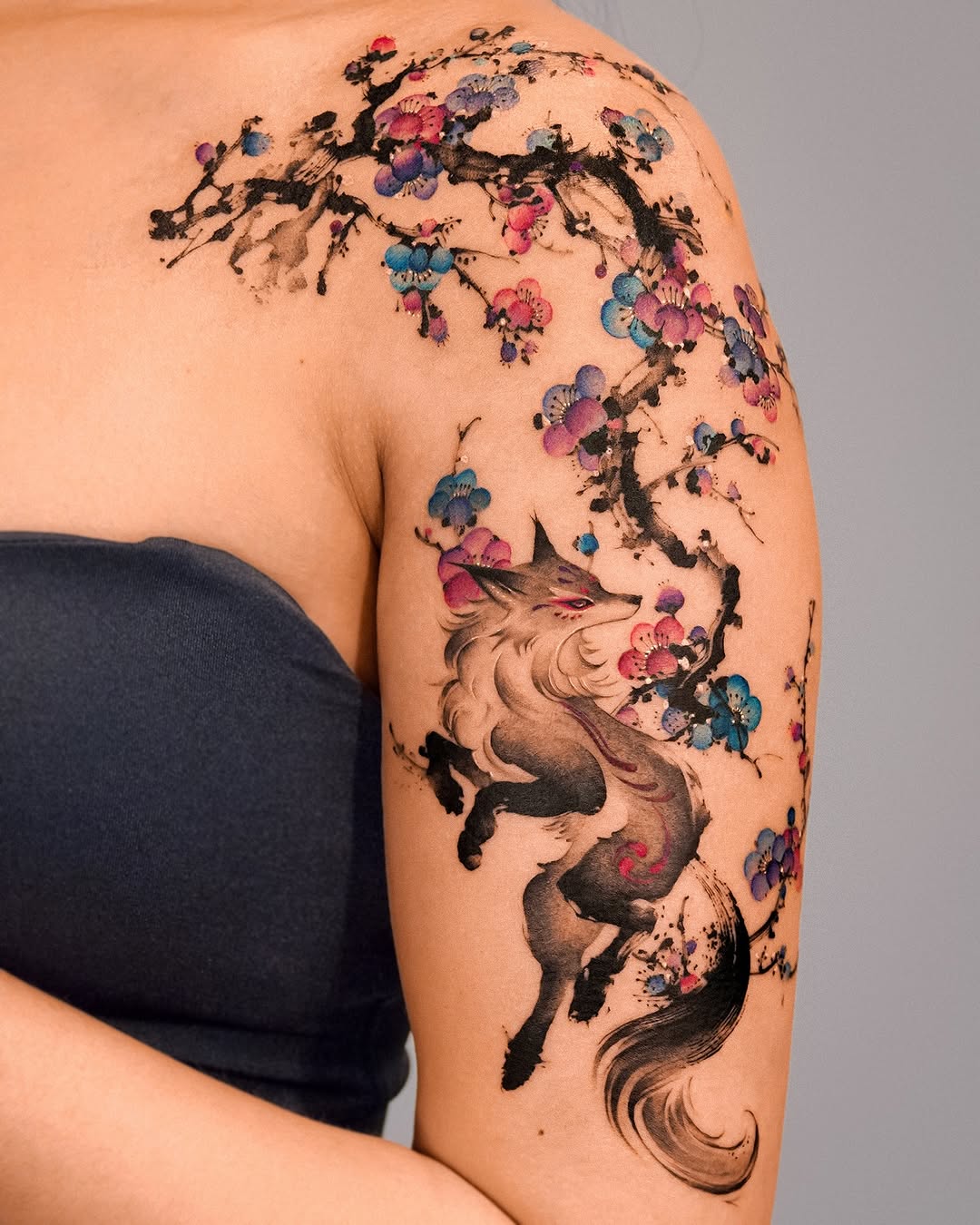 A stunning floral wolf shoulder tattoo masterpiece