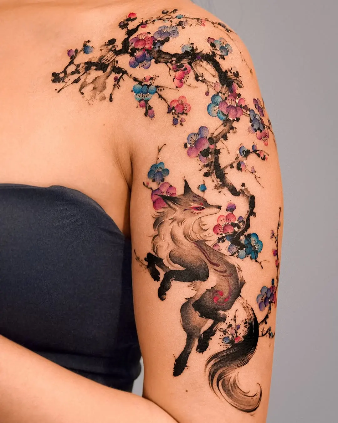 A stunning floral wolf shoulder tattoo masterpiece