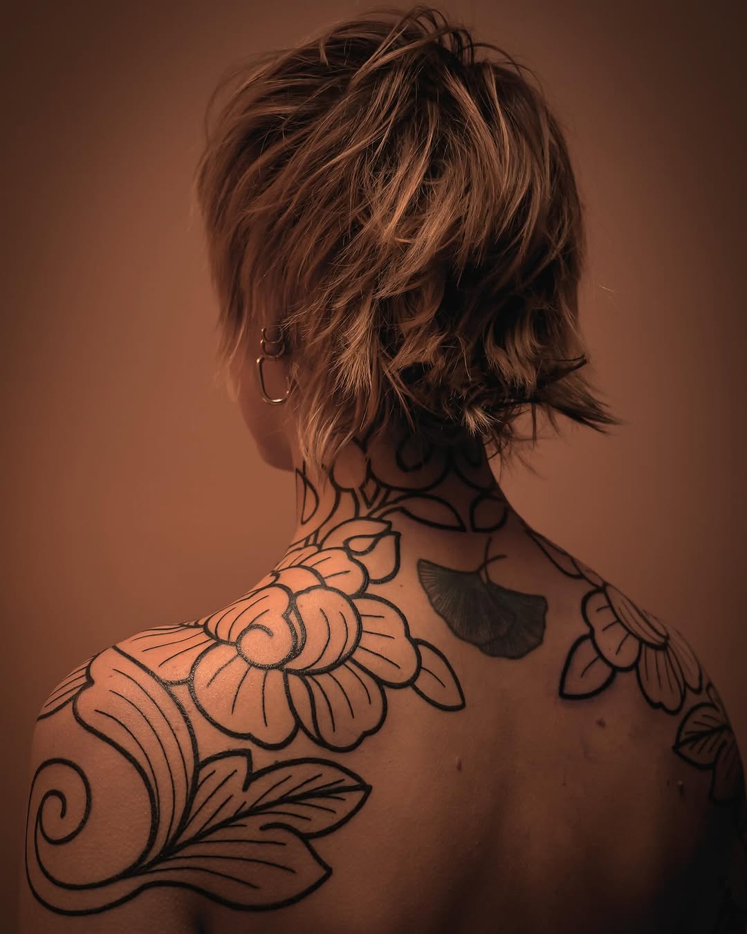 Elegant floral shoulder tattoo design