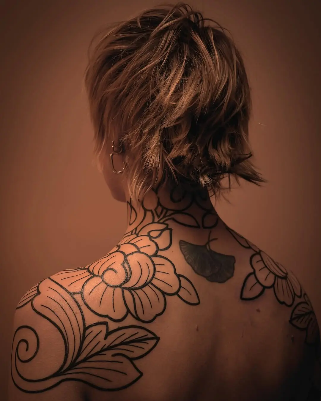 Elegant floral shoulder tattoo design