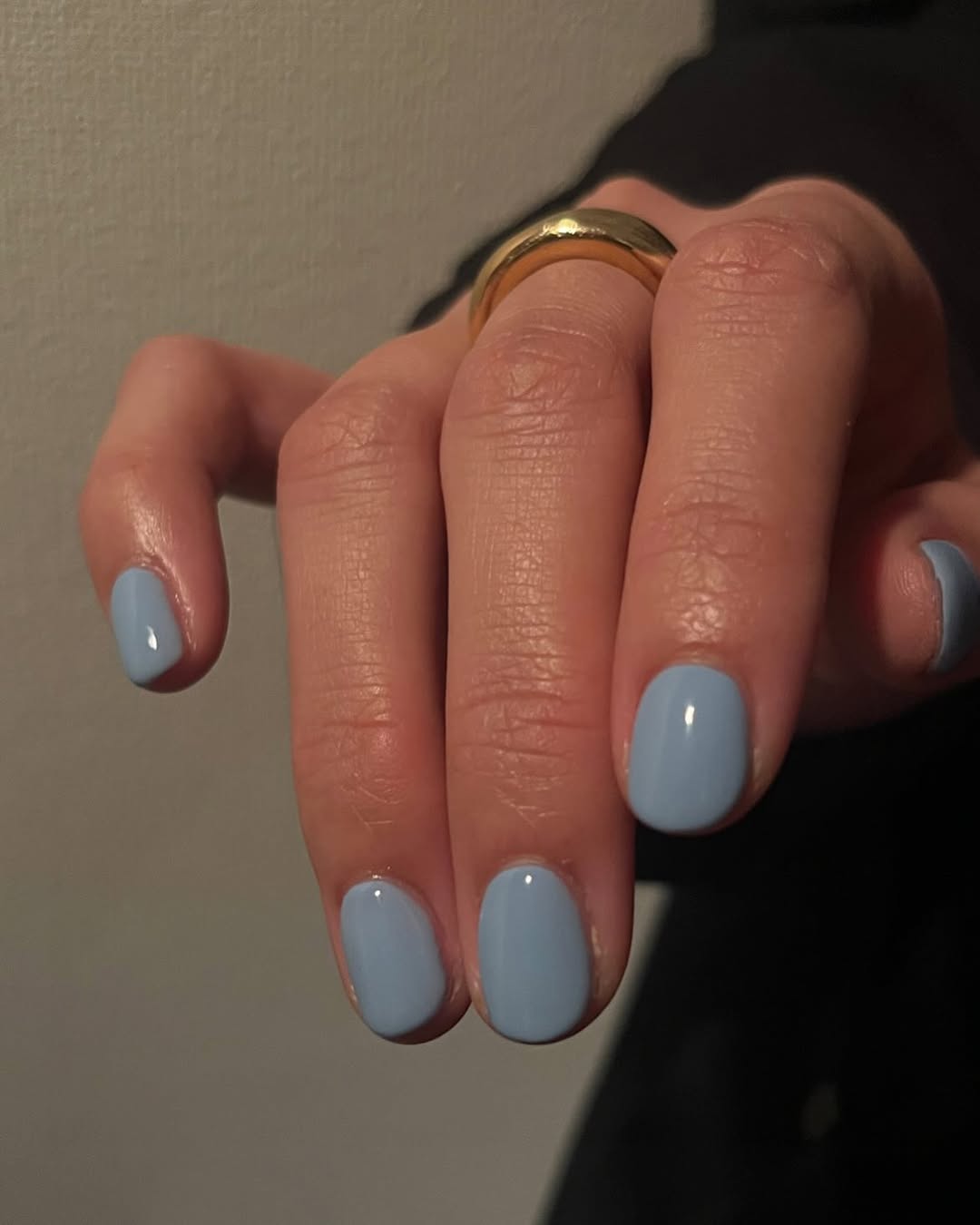 Chic blue nails paired with a stylish ring
