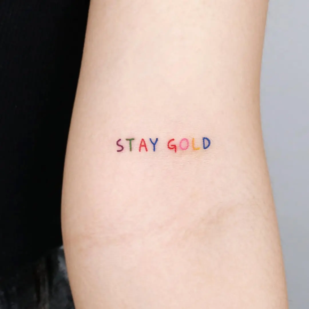 Colorful quote tattoo with a timeless message