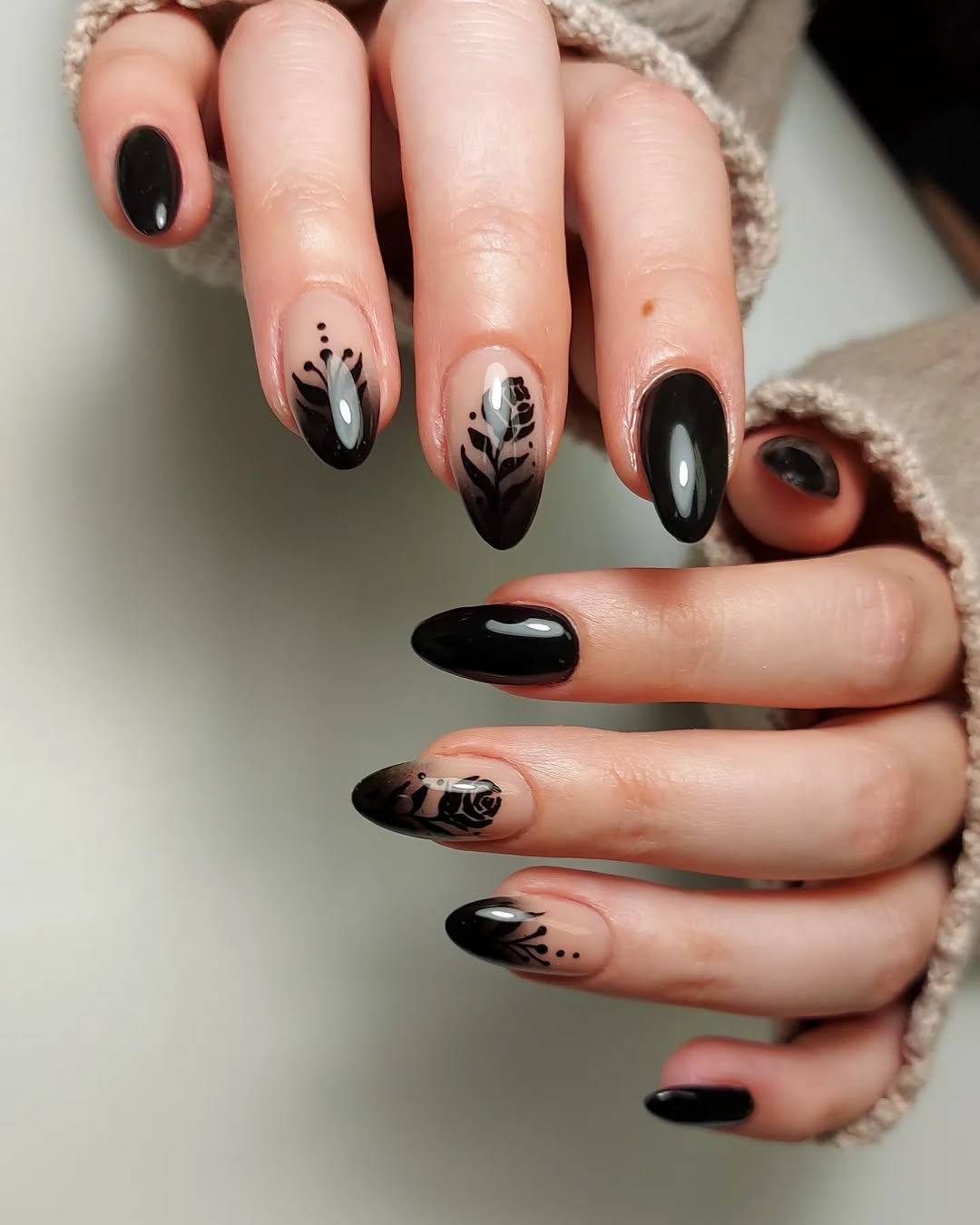 Elegant black nails with artistic detailing