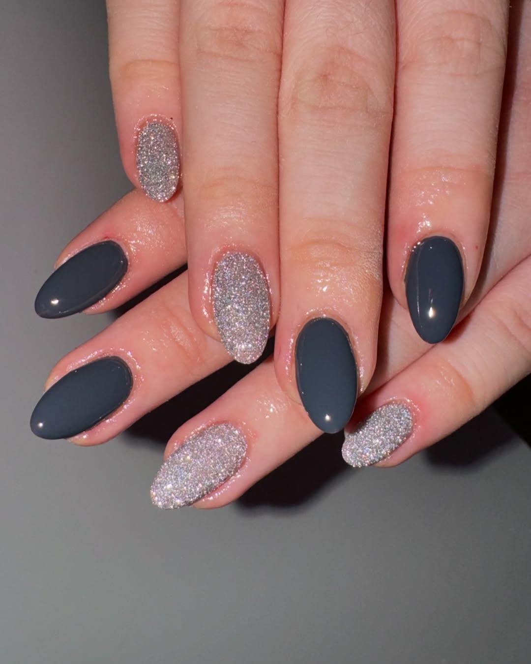 Chic grey nails with glitter accents