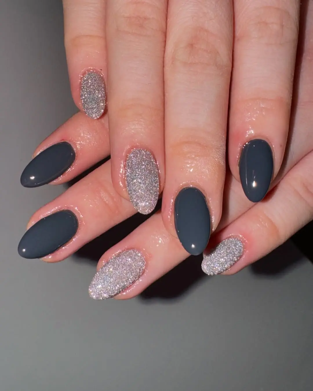 Chic grey nails with glitter accents
